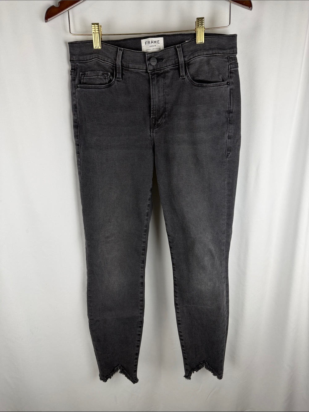Frame Denim Black High-Rise Skinny Jeans with Distressed V-Hem